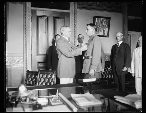 Gen. Pershing awarding the Distinguished Service Medal to Maj. Michael J. O'Brien of Adjutant Gen.'s office for "exceptionally metitorious and distinguished service as officer in charge of Officer's division. A.G.D., G.H.Q., A.E.F." July 27, 1922