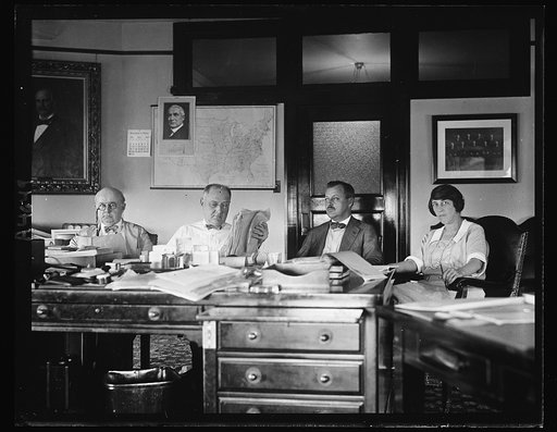 Coal strike brings hundreds of telegrams to Atty. Gen. Daughterty and Asst. Atty. Gen. Guy D. Goff, L. to R.: Asst. Atty. Gen. Goff, Atty. Gen. Daughterty, Warren F. Martin, Special Asst., and K.M. Carroll, Secy. and Asst. to the Atty. Gen.