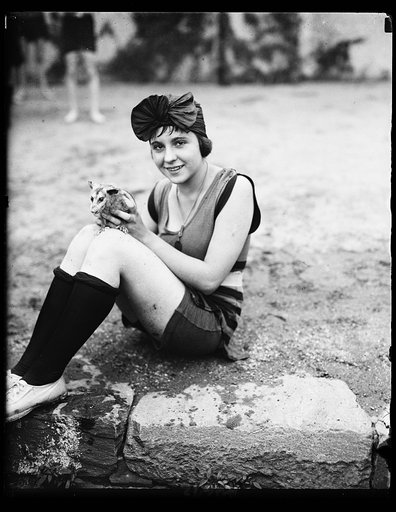Mildred Katleck and opossum at bathing beach
