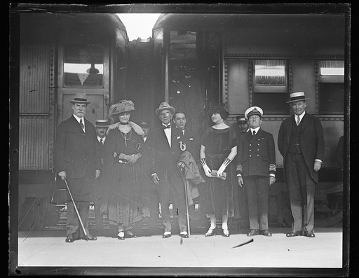 Group at train: Charles Evans Hughes and wife at left