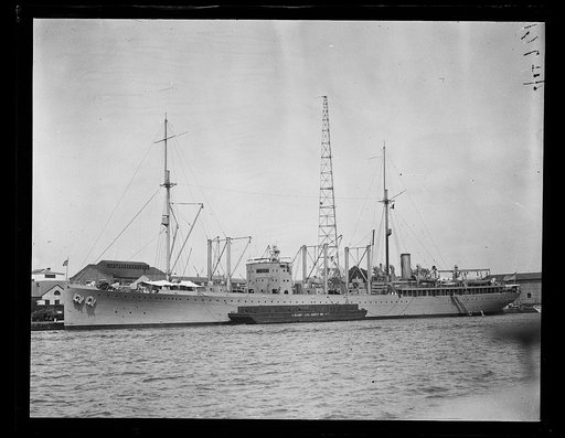 Ship; U.S. Navy coal barge in foreground