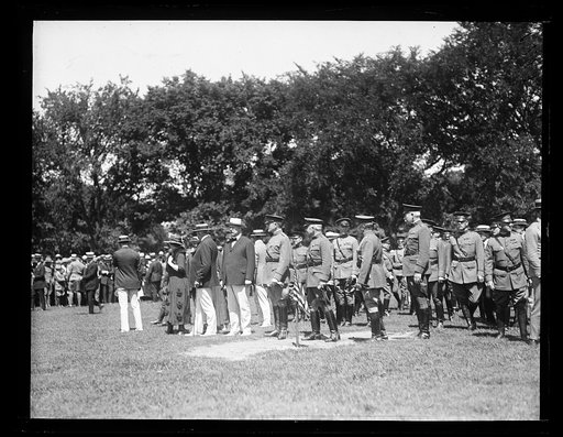 President and Mrs. Harding, and John W. Weeks with military group
