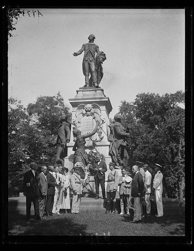 A committee of the Sons of the Revolution and others placing wreathes on statue of Lafayette at square named for him