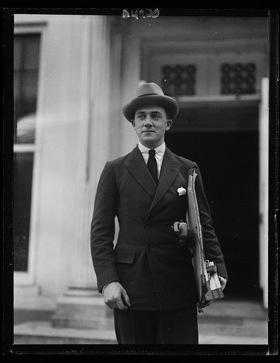 Simon Elwes, son of Lady Winnigrid Elwes, of London, leaving the White House after completing a series of pencil sketches of Pres. Harding