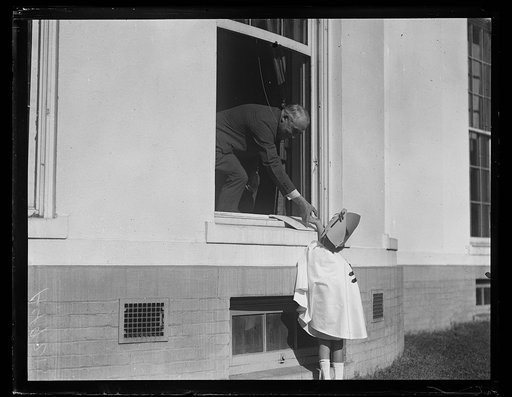 President Harding and Christmas seals child. White House, Washington, D.C.
