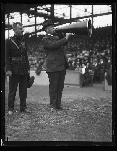 Edwin Denby with megaphone at ball field