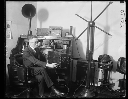 Rep. Vincent M. Brennan, of Mich., listening in at his office to the debates of floor of House. Mr. Brennan has introduced resolution providing for broadcasting to the country of the proceedings and debates of Congress through the Navy Air Station at Arlington