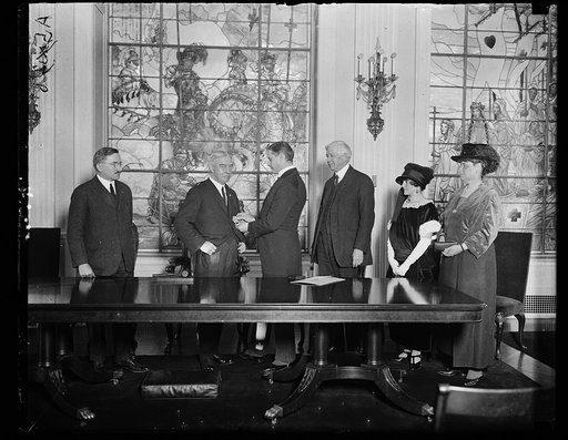 American Red Cross group Judge J.B. Payne being decorated with the Grand Star of Order of Merit
