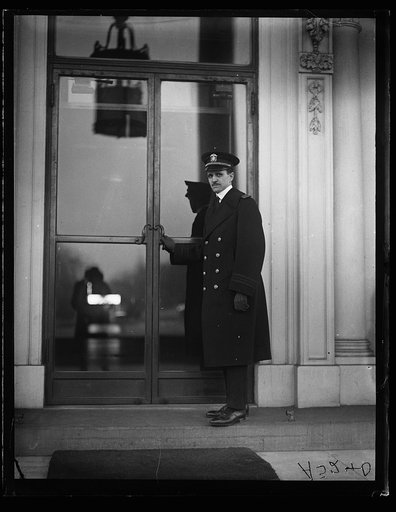 Man at entrance to White House, Washington, D.C.