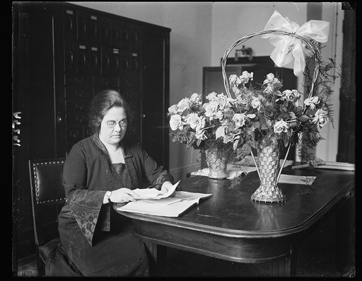 Mrs. M.E. Noland, at desk