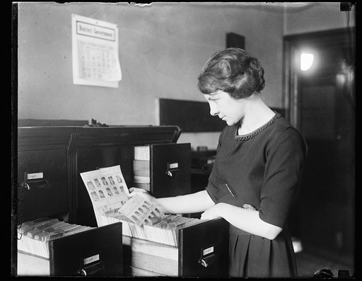 Woman viewing fingerprints in file
