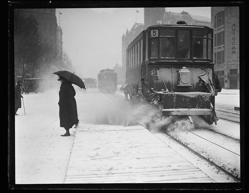 Street scene: trolley cars in snow