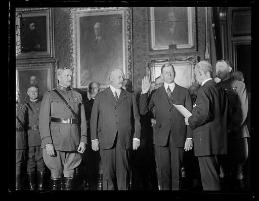 Group, left to right: John J. Pershing, John W. Weeks, Dwight Davis