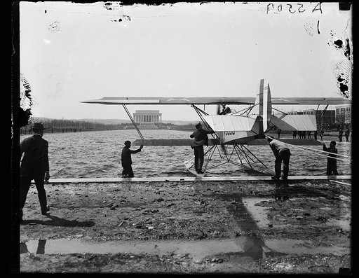 Amphibian aircraft on reflecting pool in front of Lincoln Memorial, Washington, D.C.
