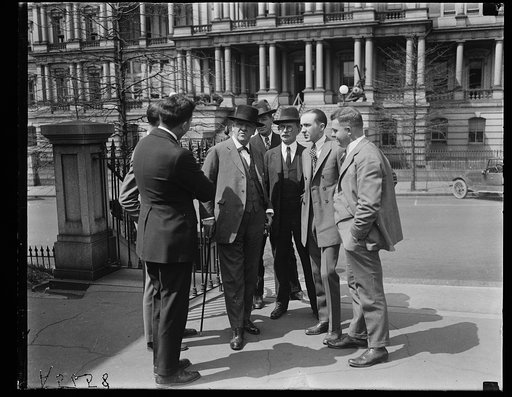 Josephus Daniels with group; State, War and Navy Building in background, Washington, D.C.
