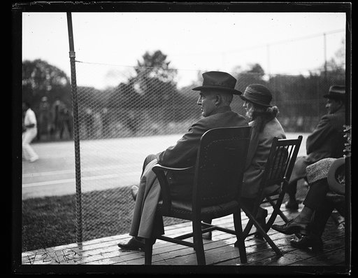 Pres. Harding watching tennis players on White House courts