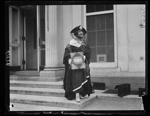 Woman with book "Roumania" at White House, Washington, D.C.