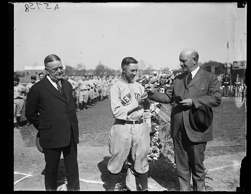 Ben Johnson, Pres. American League. Secy. Denby decorating infielder Everett Scott of N.Y. Yankees
