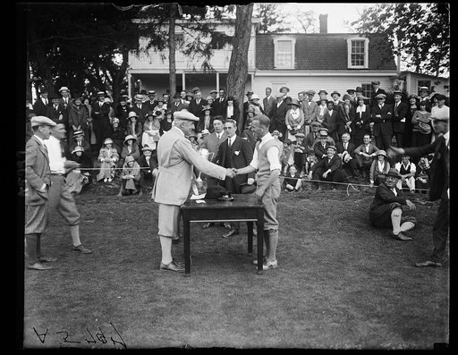 Pres. Harding congratulating winner of Washington newspaper Golf Club tournament Charles B. Shaeffer