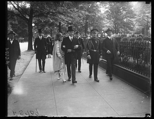 Pres. and Mrs. Harding, Amb. Harvey in rear, walking to dedication of Alexander Hamilton's statue
