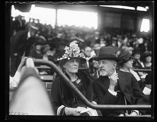 Woman and man seated at stadium