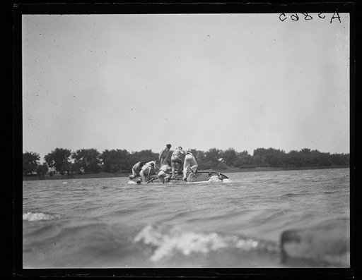 Capsized boat on river