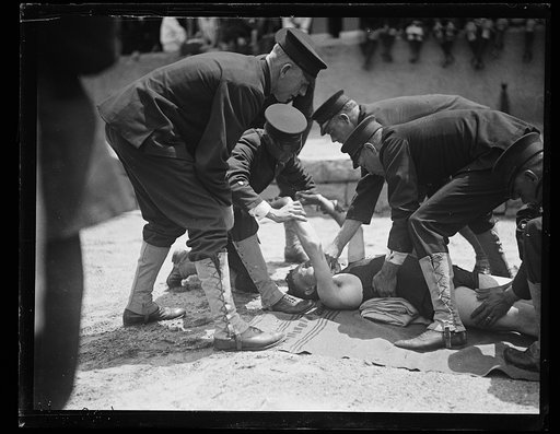 Man receiving help on beach