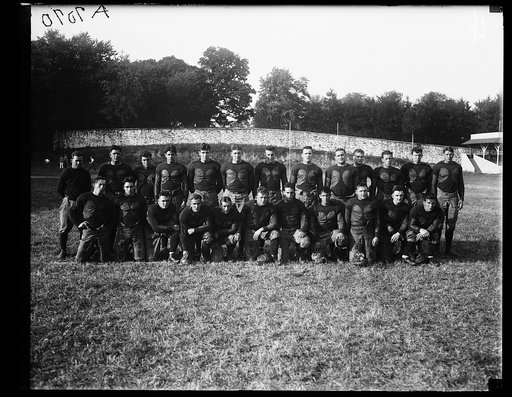 Squad coach Mason [...] standing on extreme left. G.T. [i.e., Georgetown] football team