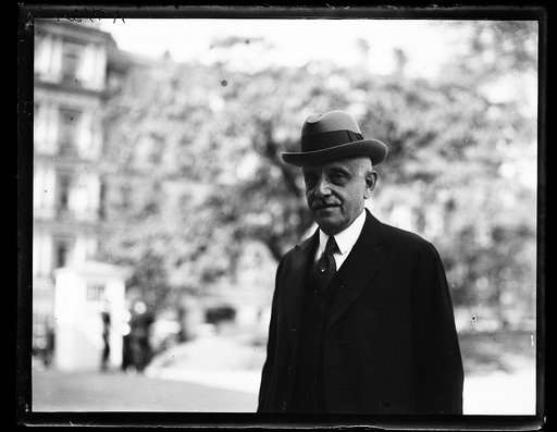 Man at White House; State, War and Navy Building in background. Washington, D.C.