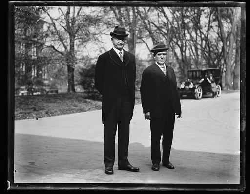 Men; State, War and Navy Building in background. Washington, D.C.