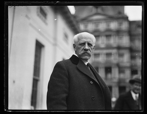 Man at White House; State, War and Navy Building in background. Washington, D.C.