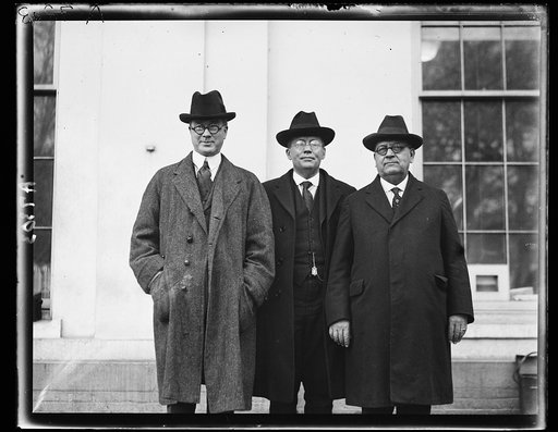 Charles J. Staples, Harry G. Kimball and Geo. H. Winslow calling on Coolidge; presented him with a certificate making him a member of the Kiwanis Clubs [White House, Washington, D.C.