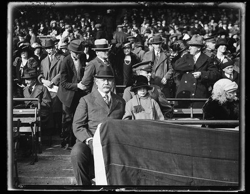 John W. Weeks seated in stadium