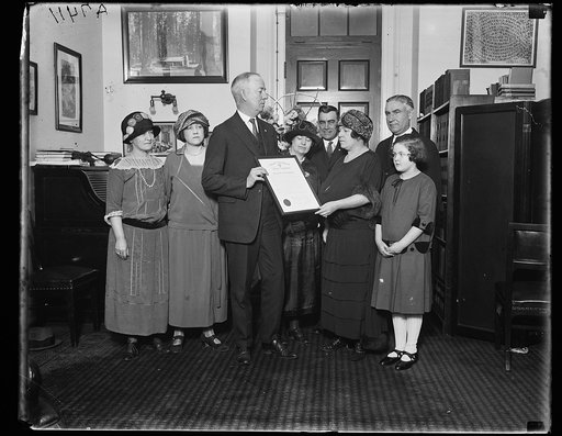 Group; man holding certificate: "National Federation of Federal Employees ... Honorable John I. Nolan"