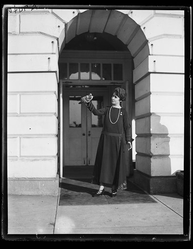 Grace Coolidge holding bird. White House, Washington, D.C.