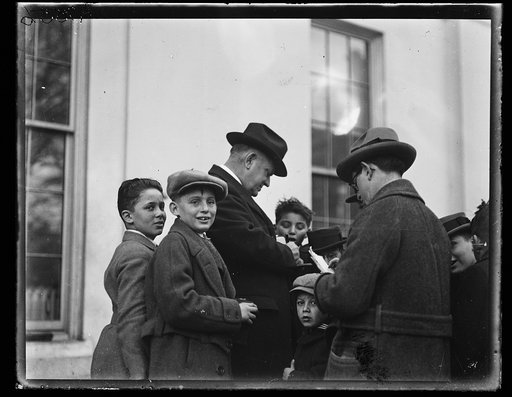 Edwin Denby with group of children outside White House, Washington, D.C.