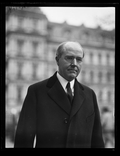 Man at White House; State, War and Navy Building in background. Washington, D.C.