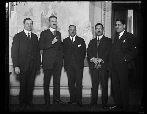 F.M. Moussa, Attache of the [...] Legation, right, introduced 2 noted [...] engineers to Allen Welsh Dulles, Chief of the Near Eastern Div. of the State Dept. The 2 engineers are K. Faki Wassef, and [...] Rifai, 3rd from left