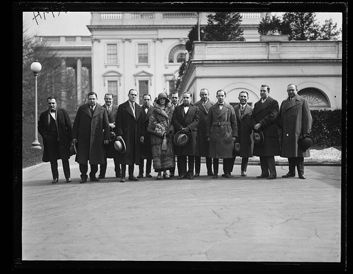 Vincent Lopez, famous orchestra leader with members of his Pa. orchestra in front of the White House