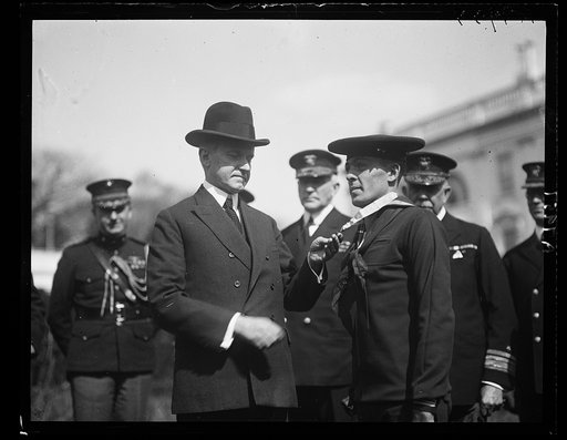 Pres. Coolidge decorating Henry B. [...]lt, Torpedo-man 2nd class, with the Congressional Medal of Honor [White House, Washington, D.C.