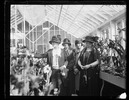 At the opening of the amaryllis show, Mrs. Coolidge, wife and daughters of Secy of Agric., left Miss Ruth, Miss Mary, and Mrs. Wallace