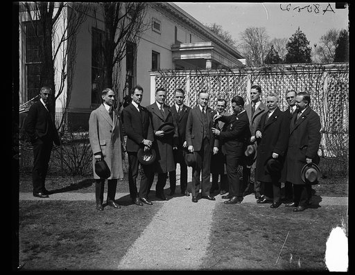 Pres. Calvin Coolidge receiving the first "Buddy Poppy" from Capt. Wm. Homer Carroll