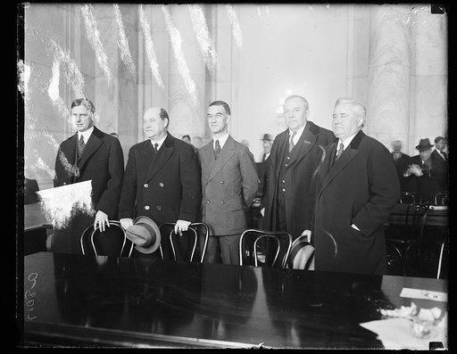 Harry F. Sinclair, multimillionaire oil magnate and his counsel at the Teapot Dome hearing, March 21st. Sinclair's counsel, led by Martin W. Littleton of N.Y., waged a 2 hr. legal battle with the oil committee in an efford to have their client excused from further questioning. Left to right: Martin 