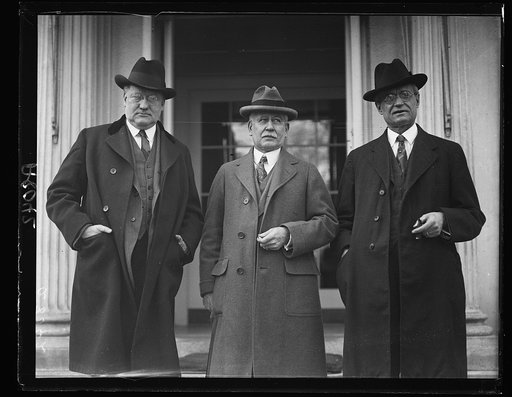 Sen. James Watson of Indiana, left, with Henry W. Marshall, center, Editor of the Journal Courier of Lafayette, Ind., and Rep. Wm. R. Ward of Ind. as they appeared at the White House when Mr. Marshall asked the Pres. to speak at Purdue Univ., May 2