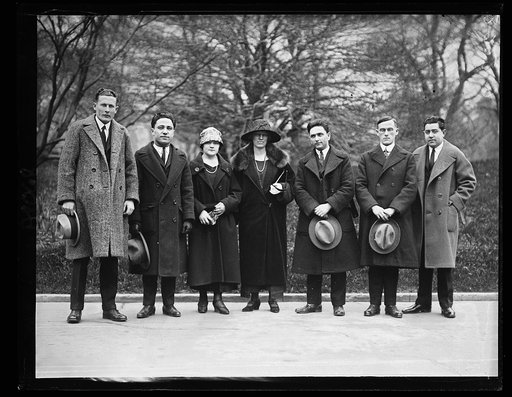 A committee from the Americanization School Mar 27 presented Pres. Coolidge with one of the school bulletins. Left to right: A.G. Bakangi, Abraham Orlean, Marie Halasi, Maud E. Aiton, Max Kossow, Walter H. Lutz, and Jos. Burke