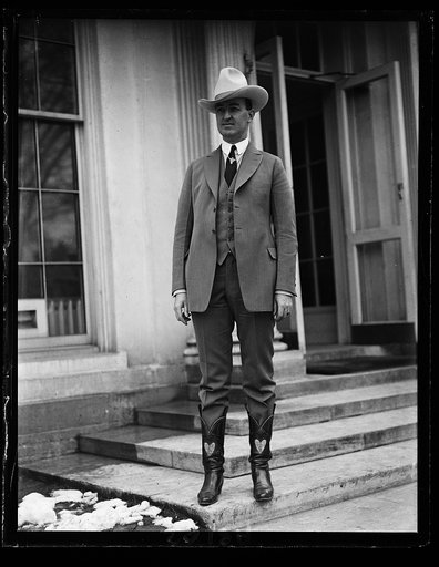 Tex Austin, of Las Vegas, New Mex., calls on Pres. Coolidge to ask the good offices of the Amer. fov't officials in London for the 100 Amer. cowboys and cowgirls who go to the Brit. Empire exposition to compete in the championship contests in the Imperial Stadium for the International championship t