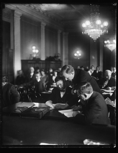 Senate prober at work. Sen. Burton K. Wheeler, chmn. of the Senate comm. investigating the Dept. of Justice, looking over testimony of Edwin S. Booth, special Asst. to the Atty. Gen., who appeared before the comm. April 7