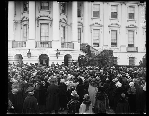 Calvin Coolidge on steps waving to crowd at White House, Washington, D.C.