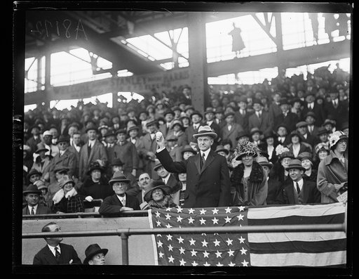 President Coolidge in stands with baseball