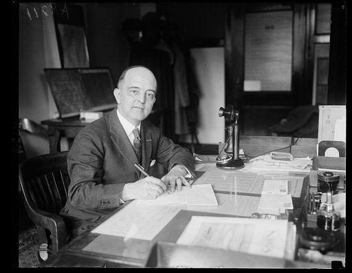 Lt. Col. A.F. Awl, Head of the Mail Sub-division of U.S. Veterans Bureau, who handles daily nearly 100,000 pieces of mail written in 41 different languages